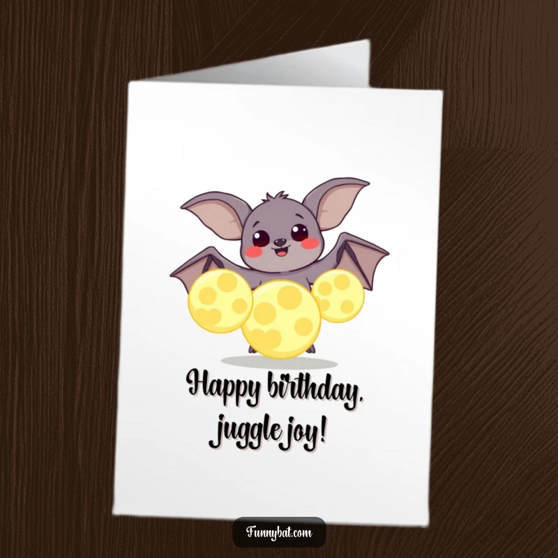 Funny Free Printable Birthday Card: A plump bat with happy eyes attempting to juggle huge, glowing moons.